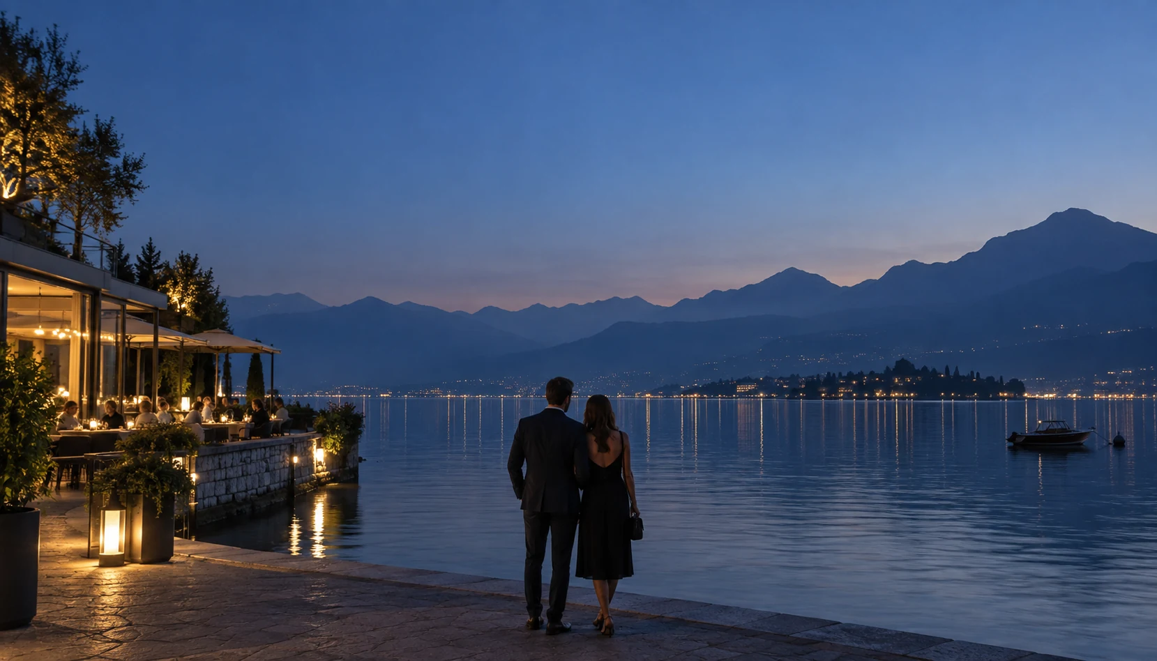 A couple making time for each other on a lakeside terrace at dusk